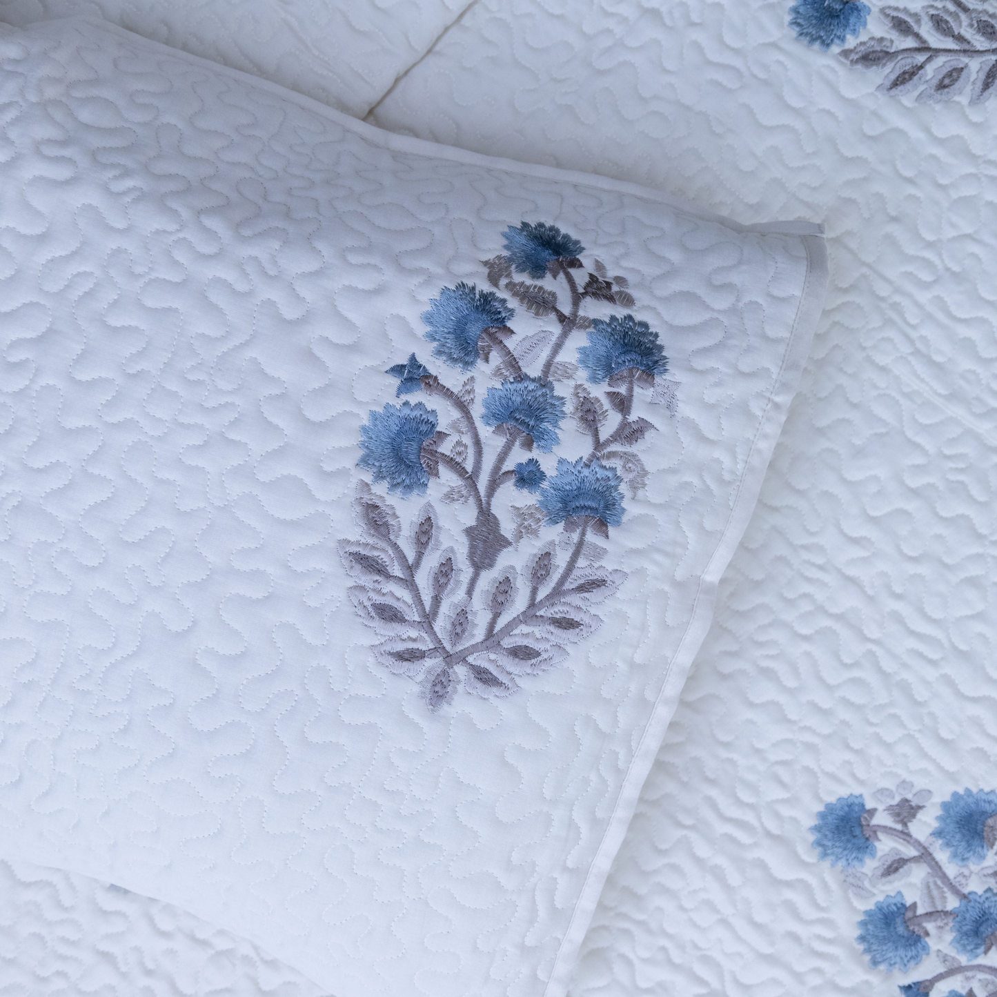 Floral sonata embroidered bed cover blue